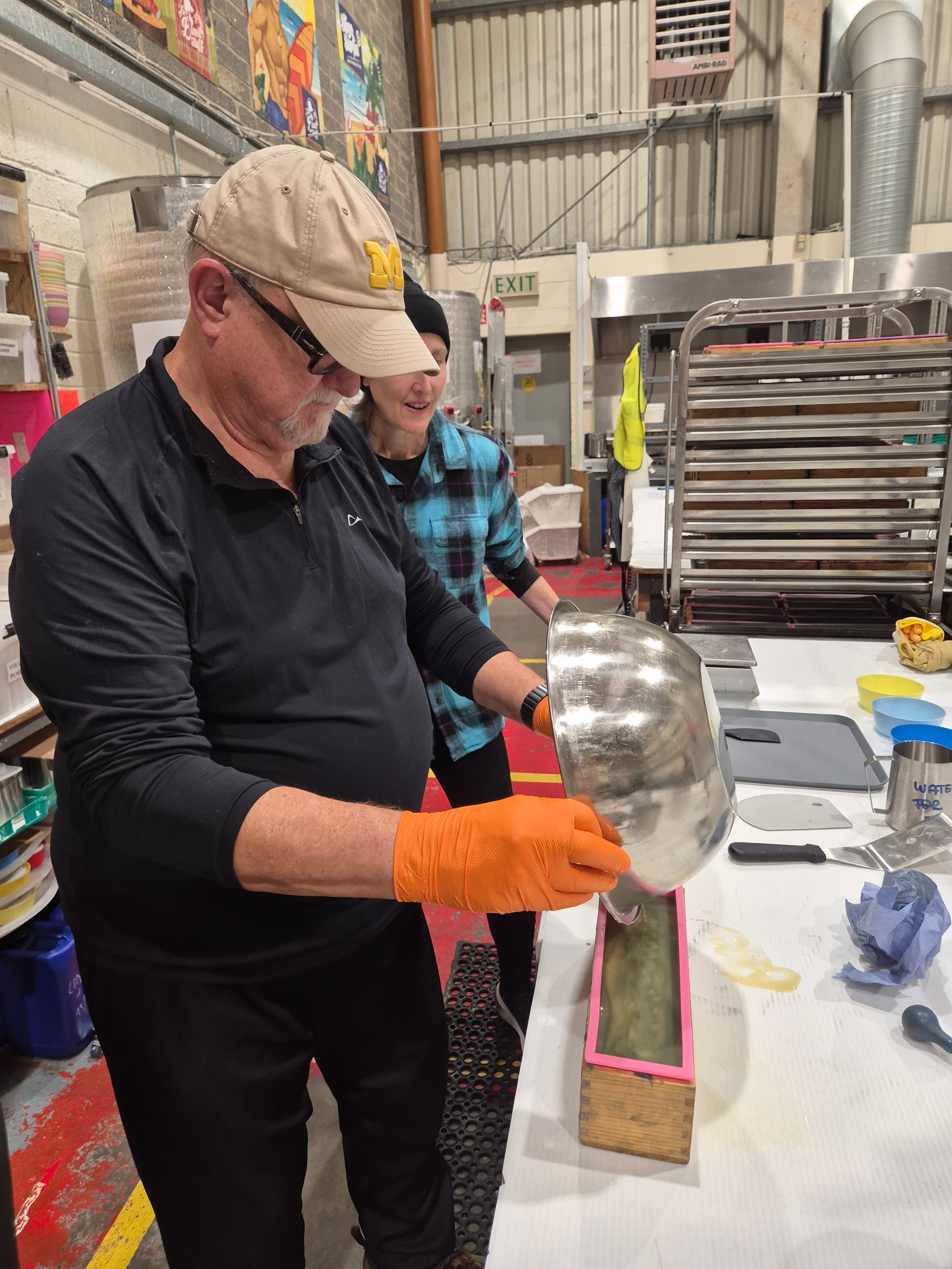 Winner pouring soap into the mould at The Black Stuff workshop